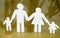 Family silhouettes with children isolated on yellow background