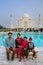 Family sitting on a bench at Taj Mahal complex in Agra, Uttar Pr