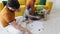 Family sitting on the floor and painting with colorful crayons