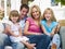 Family sitting on patio smiling