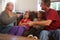 Family Sitting On Sofa With Parents Arguing