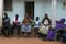 Family sittting in front of their house at the Cupelon de Cima neighborhood in the city of Bissau, Guinea Bissau