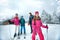 Family on ski slope on vacation in mountain