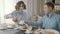 A family with a small child in a restaurant: dad, mom and daughter