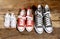 Family Sneakers canvas shoes parents and child on wood floor at home in happy lifestyle