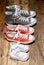 Family Sneakers canvas shoes parents and child on wood floor at home in happy lifestyle