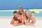 Family With Snorkels Enjoying Beach Holiday