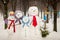 Family of snowmen outdoors