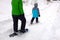 Family Snowshoeing in the Winter Snow kids having fun