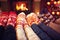 Family in socks near fireplace in winter