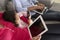 Family On Sofa With Smartphone, Laptop And Digital Tablet