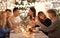 Family with sparklers having dinner party at home