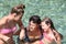 Family spending time together in a crystalclear water of river