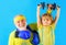 Family sport. Grandpa and son workout together. Kid boy raising dumbbell. Grandfather and child sporting.