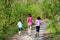 Family sport, happy active mother and kids jogging outdoors
