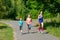 Family sport, mother and kids jogging outdoors