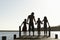 Family Standing On Edge Of Jetty
