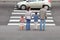 Family standing near pedestrian crossing