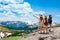 Family standing on top of the mountain looking at beautiful view.