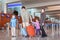 Family with suitcases in airport hall