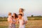 Family at sunset on sloping field  countryside