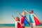 Family of superheroes on the beach. Summer vacation concept