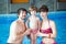 Family swimming in the pool. Happy family spends time and relax in the swimming pool