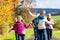 Family take walk in autumn forest flying kite