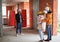 Family talking with builder at construction site.