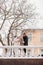 a family with a teenage daughter and a dog on a winter street.