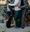 The family of their four people hugging against the background of the Christmas tree. parents and two children. Family photo, phot