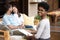 Family therapists during session with couple posing looking at camera