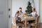 Family of three having lunch for Christmas holidays