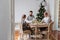 Family of three having lunch for Christmas holidays