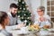 Family of three having lunch for Christmas holidays