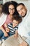 Family of three looking at camera. Mother  father  and son sitting