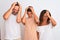 Family of three, mother, father and son standing over white isolated background suffering from headache desperate and stressed