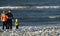 Family of three on pebble beach