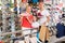 Family of three picking sport shoes in store