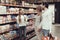 Family of Three in Supermarket Buying Cookies.