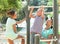 Family of three together training on pull-up bar