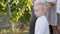 Family of three in white clothes stands