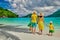 Family with three year old boy on beach. Seychelles, Mahe, Port Launay
