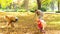 Family throwing leaves into air.