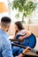 Family time. Father and daughter together at home. Cute little girl and father playing guitar