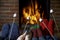 Family Toasting Marshmallows By Open Fire At Home