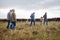 Family together, cattle field and business with people you love. Countryside farmer parents walking in meadow with