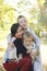 Family together in plaid on autumn picnic