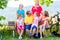 Family on tour with bikes having rest on bench