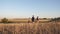 Family of tourists on journey. Dad with two daughters on a camping trip. Children and father with backpacks are walking